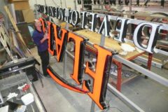 Sign being fabricated
